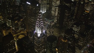 AX85_069 - 4K aerial stock footage Flying by Chrysler Building, Midtown Manhattan, New York, New York, night