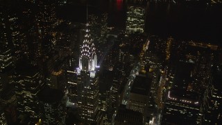 AX85_071 - 4K aerial stock footage Flying by Chrysler Building, Midtown Manhattan, New York, New York, night