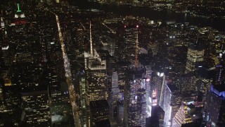 AX85_072 - 4K aerial stock footage Bank of America Tower, Times Square, Midtown Manhattan, New York, night