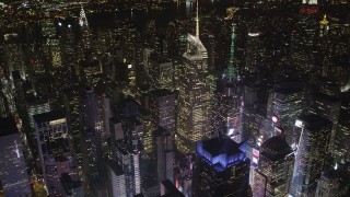 AX85_074 - 4K aerial stock footage Bank of America Tower, Times Square, Midtown Manhattan, New York, night