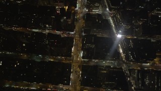 AX85_086 - 4K aerial stock footage Bryant Park, Avenue of the Americas, Midtown Manhattan, New York, night 