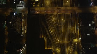 AX85_090 - 4K aerial stock footage West Side Yard, Chelsea streets, New York, New York, night