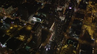 AX85_092 - 4K aerial stock footage Flying by skyscrapers, Chelsea, New York, New York, night