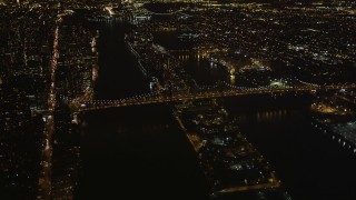 AX85_099 - 4K aerial stock footage Approaching the Queensboro Bridge, New York, New York, night