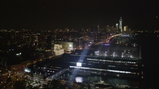 AX85_114 - 4K aerial stock footage Flying over piers along Hudson River, Chelsea, New York, New York, night