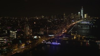 AX85_115 - 4K aerial stock footage Fly over piers, Hudson River, Chelsea, Lower Manhattan, New York, New York, night