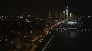 AX85_116 - 4K aerial stock footage Fly over piers, Hudson River, Chelsea, Lower Manhattan, New York, New York, night