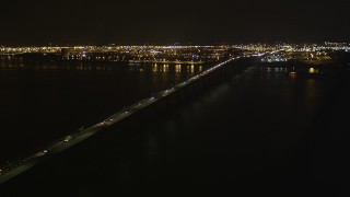AX85_141 - 4K aerial stock footage Flying by the Newark Bay Bridge, Newark, New Jersey, night