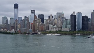 AX86_003 - 4K aerial stock footage tilt from the Hudson River to reveal the skyline of Lower Manhattan, New York City