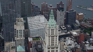 AX86_006 - 4K aerial stock footage of the top of the Woolworth Building in Lower Manhattan, New York City