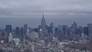 AX86_020 - 4K aerial stock footage of a wide view of the Empire State Building and Midtown Manhattan, New York City