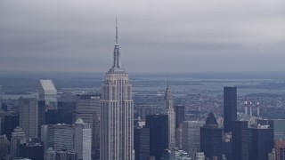AX86_029 - 4K aerial stock footage of the Empire State Building and Chrysler Building in Midtown Manhattan, New York City