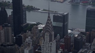 AX86_039 - 4K aerial stock footage of approaching the top of the Chrysler Building in Midtown Manhattan, New York City