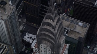 AX86_040 - 4K aerial stock footage approach top of the Chrysler Building, tilt to bird's eye view, Midtown Manhattan, New York City