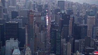 AX86_055 - 4K aerial stock footage tilt from Central Park to reveal Times Square in Midtown, New York City