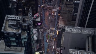AX86_057 - 4K aerial stock footage a bird's eye view of traffic and tourists in Times Square in Midtown, New York City