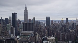 AX86_061 - 4K aerial stock footage fly past Midtown Manhattan, reveal Empire State Building, New York City