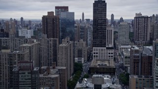 AX86_064 - 4K aerial stock footage flyby skyscrapers and apartment complexes, Upper West Side, New York City