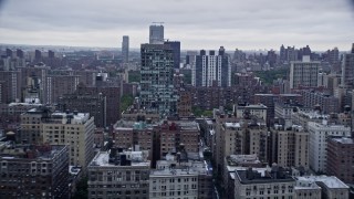 AX86_067 - 4K aerial stock footage of passing by apartment complexes on the Upper West Side, New York City