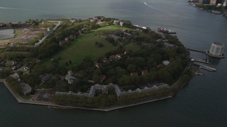 AX87_042 - 4K aerial stock footage Flying by Governors Island, New York Bay, New York, New York