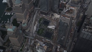 AX87_069 - 4K aerial stock footage Tilt down on World Trade Center Memorial, Lower Manhattan, New York, New York