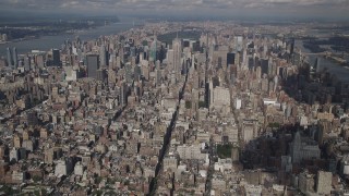AX87_072 - 4K aerial stock footage Fly over Washington Square Village, reveal Midtown Manhattan, New York