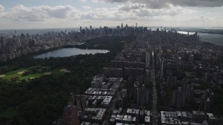 AX87_126 - 4K aerial stock footage Flying away from Central Park, Upper West Side, New York, New York