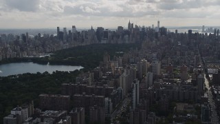 AX87_127 - 4K aerial stock footage Flying away from Central Park, Upper West Side, New York, New York