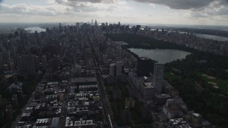 AX87_135 - 4K aerial stock footage Flying by the Upper East Side, Central Park, New York, New York