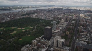 AX87_157 - 4K aerial stock footage Flying over Upper East Side buildings, Central Park, New York, New York