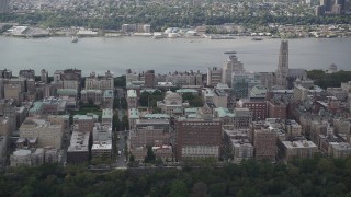 AX87_159 - 4K aerial stock footage Flying by Columbia University, with views of the Hudson River, New York, New York