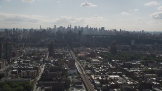 AX87_181 - 4K aerial stock footage Flying by Midtown Manhattan skyline, seen from Harlem, New York, New York