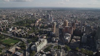 AX88_008 - 4K aerial stock footage of approaching Long Island University Brooklyn Campus and skyscrapers, Brooklyn, New York