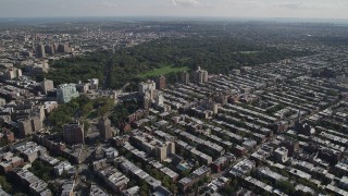 AX88_015 - 4K aerial stock footage of flying over row houses toward Prospect Park, Grand Army Plaza, Brooklyn, New York