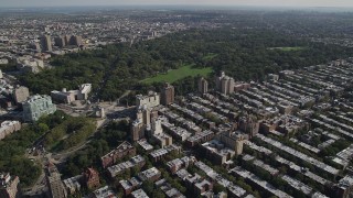 AX88_016 - 4K aerial stock footage of approach Prospect Park and Grand Army Plaza from row houses, Brooklyn, New York