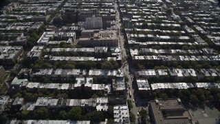 AX88_017 - 4K aerial stock footage of flying over row houses in urban neighborhoods, Brooklyn, New York