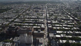 AX88_018 - 4K aerial stock footage of flying over row houses and city streets in Brooklyn, New York