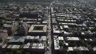 AX88_020 - 4K aerial stock footage of flying by 8th Avenue Armory and row houses, Brooklyn, New York