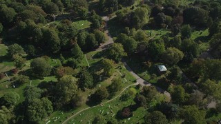 AX88_024 - 4K aerial stock footage of tilting to graves at Green-Wood Cemetery, Brooklyn, New York