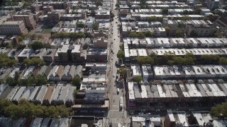 AX88_026 - 4K aerial stock footage of flying over 8th Avenue and row houses, Brooklyn, New York