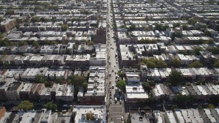 AX88_027 - 4K aerial stock footage of flying over 8th Avenue and row houses, Brooklyn, New York