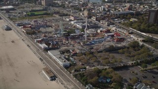 AX88_045 - 4K aerial stock footage of flying by Luna Park rides in Coney Island, Brooklyn, New York City, New York