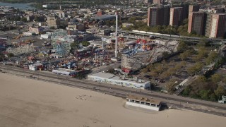 AX88_046 - 4K aerial stock footage of flying by rides at Luna Park in Coney Island, Brooklyn, New York City, New York