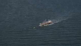 AX88_053 - 4K aerial stock footage of tracking small oil tanker in the Atlantic Ocean