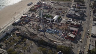 AX88_057 - 4K aerial stock footage of flying by rides and beach at Luna Park in Coney Island, Brooklyn, New York, New York