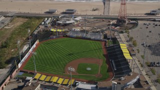 AX88_060 - 4K aerial stock footage of approaching baseball field at Luna Park, Coney Island, Brooklyn, New York