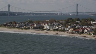 AX88_067 - 4K aerial stock footage of passing by beachfront homes in Coney Island, Brooklyn, New York, New York