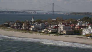 AX88_068 - 4K aerial stock footage of flying by up0scale beachfront homes in Coney Island, Brooklyn, New York, New York
