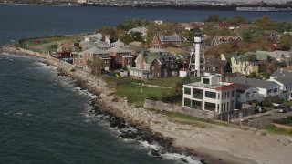 AX88_071 - 4K aerial stock footage of flying by oceanfront homes in Coney Island, Brooklyn, New York, New York