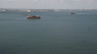 AX88_090 - 4K aerial stock footage of two Staten Island Ferries sailing New York Harbor, New York, New York